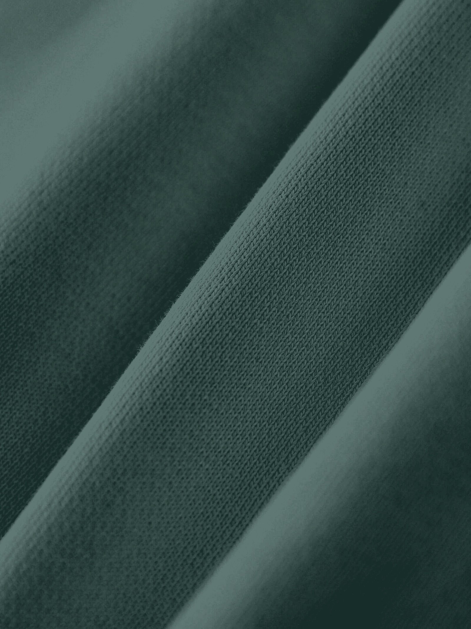 Heavyweight cotton sweatpants 530gsm Retro Green — fleece fabric closeup